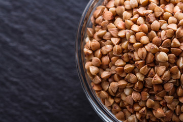 Grain buckwheat on a dark stone background
