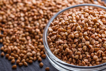 Grain buckwheat on a dark stone background