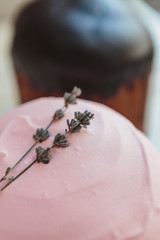 Happy Easter background with an easter bread cake decorated with glaze, chocolate and  eggs. For greeting card, ad, promotion, poster, flyer. complex composition, beautiful scenery, movement, hands