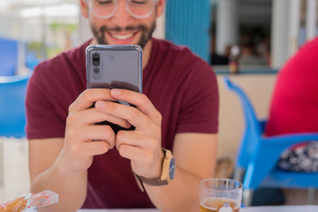young man typing a message
