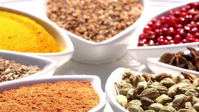 Spices. Various Indian. Spice and herbs rotate. Assortment of Seasonings, condiments. Cooking ingredients, flavor. 4K video Beautiful view