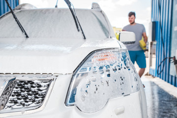 car wash concept. vehicle in soap