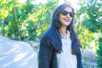 young indian woman smiling in the nature