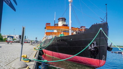 19236_The_black_cargo_ship_docking_in_lennusadam_port_in_Tallinn_Estonia.jpg