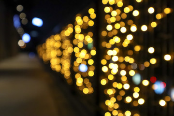 Abstract background of defocused on lights with bokeh effect.  Blurred background, copy space for editing and text.