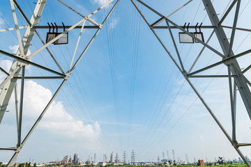 High voltage towers in the blue sky white cloud background