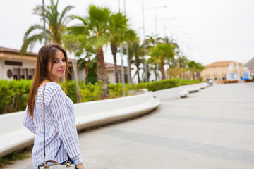 Fototapeta premium young woman walking in the city