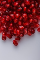 grains of a grenade on a white acrylic background