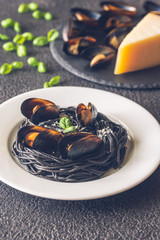 Black pasta with mussels and parmesan