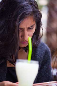 young woman drinking in the bar
