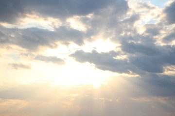sun behind the clouds