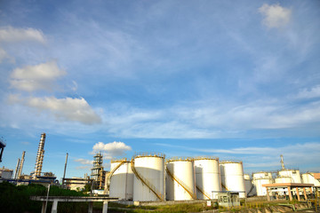 Obraz premium Big white gasoline and oil industry of storage tanks in the blue sky white cloud background