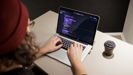 Programmer and coder working in the development environment. Programmer's workplace