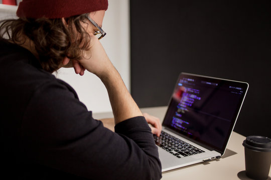 Programmer and coder working in the development environment. Programmer's workplace