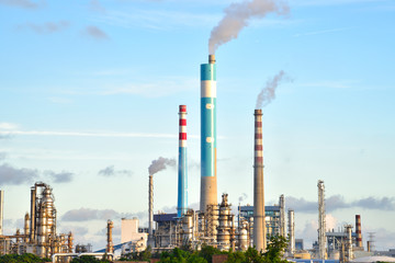 Oil refineries and power plants under the blue sky white clouds