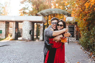 Couple in love walking in the autumn streets