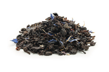 The heap of dry black tea with flowers isolated on white background.