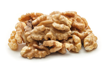 Pile of peeled walnuts isolated on white background. Walnuts kernel closeup.