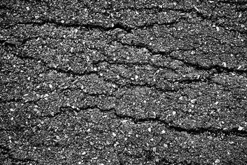 crack and texture of asphalt road - top view background.