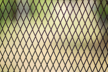 Fototapeta premium Iron wire fence. Fence grilles rust texture background. Fence Steel Background.