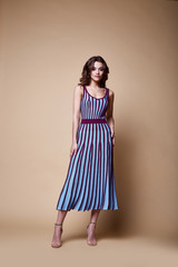 Sexy beauty woman pretty face tan skin wear knitted blouse skirt long skinny body shape makeup...