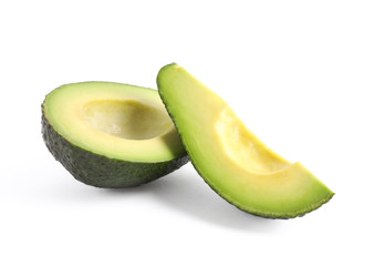 Ripe cut avocado with slice isolated on white background. Healthy food