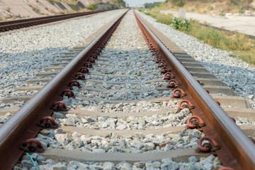 Close up rail joint, rail anchor with perspective line from railroad  tracks. Safety transportation. Avoid traffic jam. Public transportation for reduce green house effect. Saving energy and fuel.