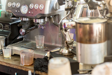 Coffee machine ready to make good a cup of espresso in cafe. coffee machine making a cup of coffee in restaurant. coffee machine preparing cup.