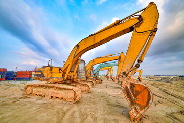 Large excavator under the blue sky white clouds