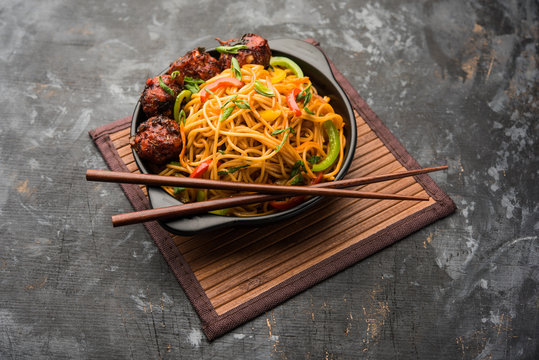Manchurian Hakka / Schezwan noodles, popular indochinese food served in a bowl. selective focus