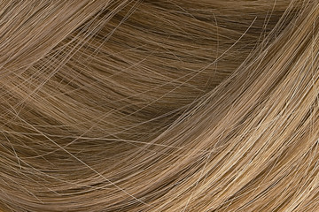 Brown hair as background, texture. One of the popular shades of hair coloring