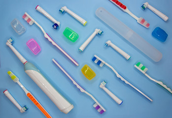 Top view of toothbrushes in colorful on pastel color background.