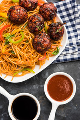 Manchurian Hakka / Schezwan noodles, popular indochinese food served in a bowl. selective focus