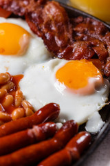 delicious English breakfast on a dark rustic background