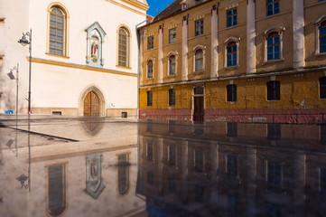 Fototapeta na wymiar Marble Reflections of The Church of the Ursulines in Sibiu, Romania