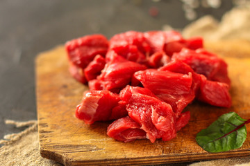 meat raw sliced, cut pieces on a cutting board, fresh. top view. food background