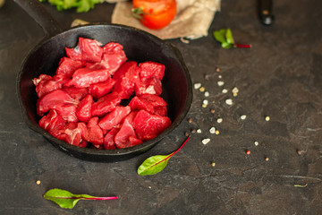 meat raw sliced, cut pieces on a cutting board, fresh. top view. food background