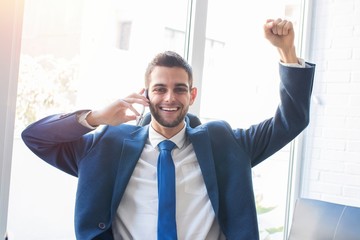 business man with mobile phone and success