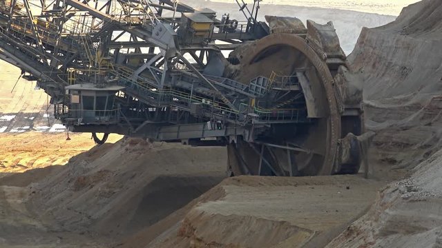 Bucket-wheel excavator in open-cast mining pit in Germany