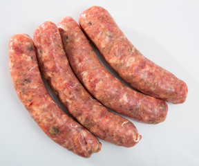 Appetizing uncooked meat sausages