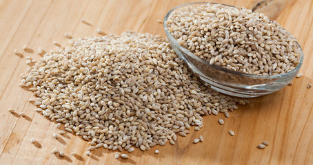 Pearl barley  on wooden surface