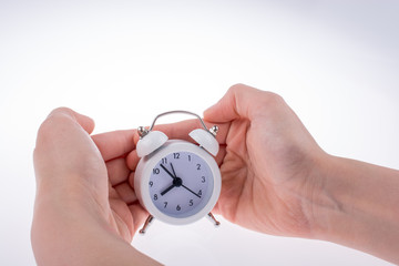 Alarm clock in hand