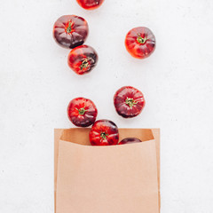 Tomatoes Mar Azul on white wooden table background