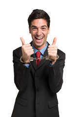 Happy businessman wearing handcuffs