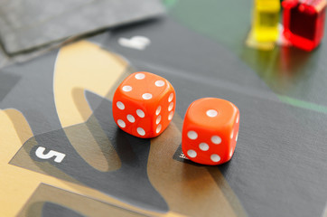 Dice cubes on the playing field. Concept board game, leisure, entertainment, recreation.