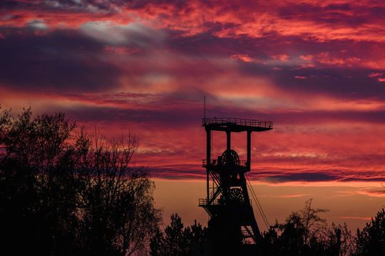 .Mine shaft with sunset in the background