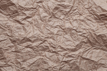 Crumpled kraft paper. Texture crumpled recycled old paper.