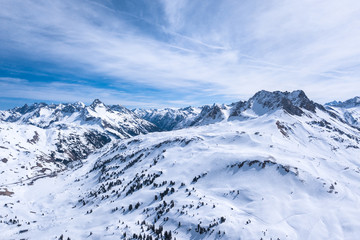 winter landscape with blue sky in austria by drone