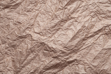 Crumpled kraft paper. Texture crumpled recycled brown paper.