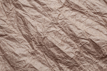 Crumpled kraft paper. Texture crumpled recycled old brown paper.